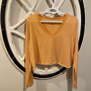 cropped, yellow and white long sleeve shirt.
